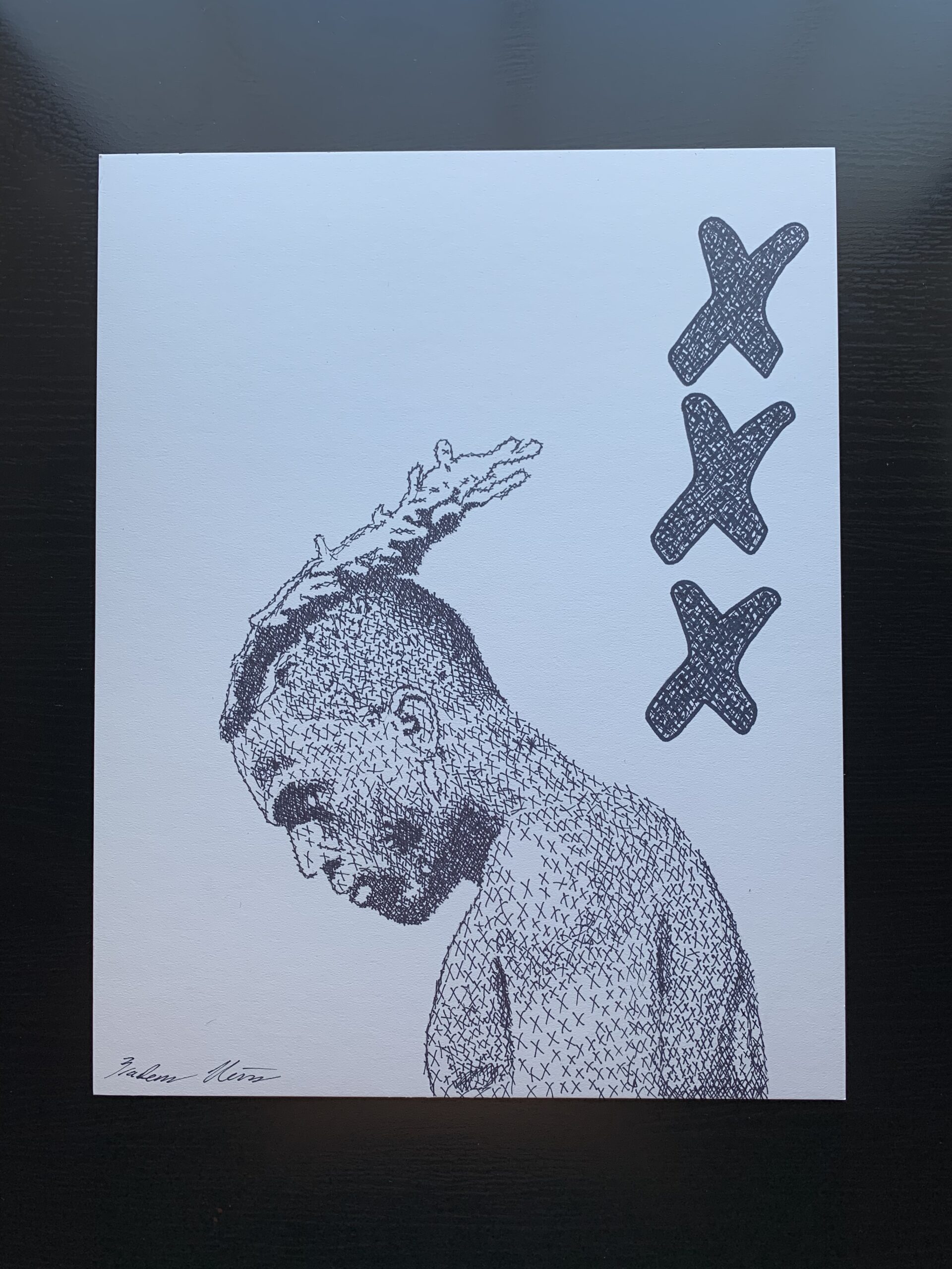 A sharpie drawing of the side profile of a man looking down toward the ground with three "x's" at the top right.