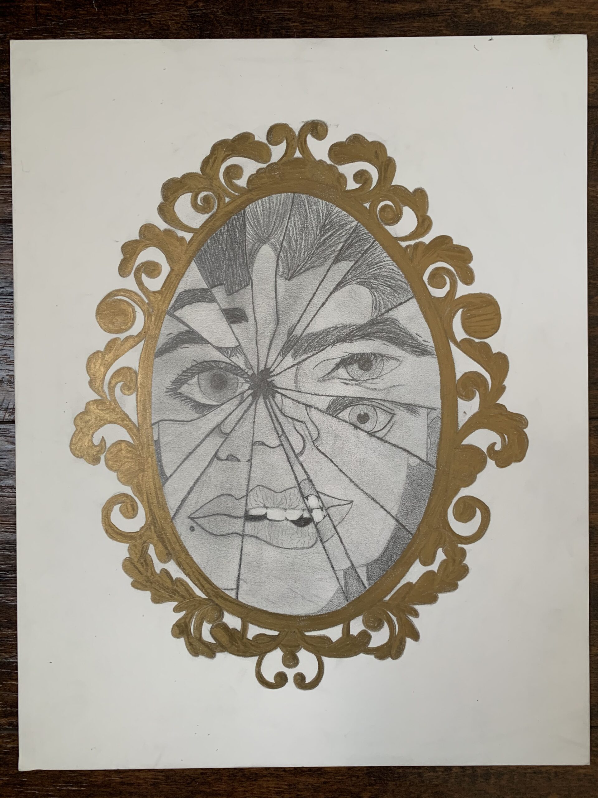 A hand drawn gold mirror that is shattered. In the reflective mirror you can see a face.