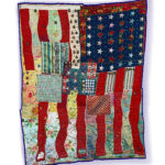 A sewn and beaded quilt depicting an abstracted American Flag.