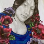 a portait of a female with a blue shirt and flowers surrounding the shirt