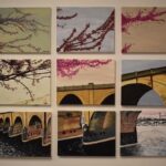 Nine blocks placed together so that an interpretive painting of a bridge in Harrisburg emerges.