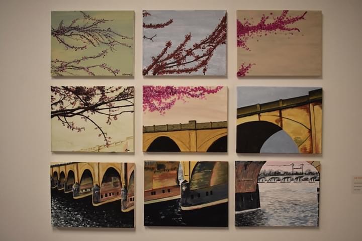 Nine blocks placed together so that an interpretive painting of a bridge in Harrisburg emerges.